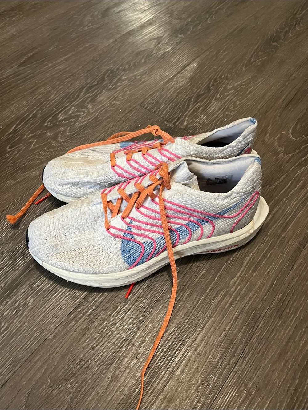 Nike Women's Light Gray Running Shoes with Pink & Orange Accents